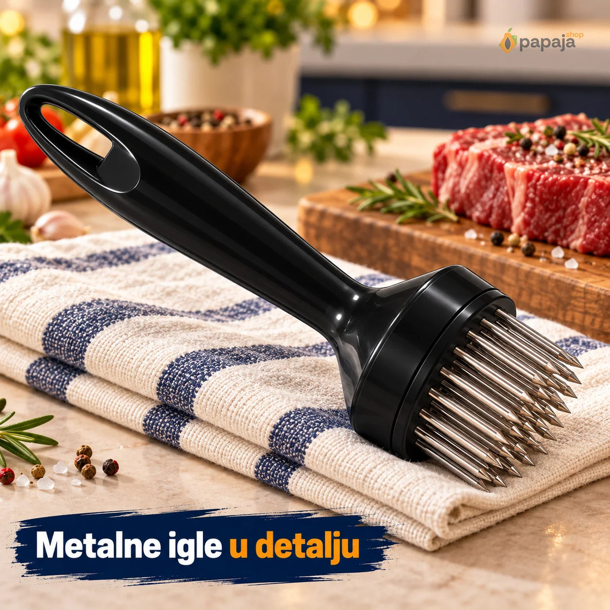 Metalne igle i kružno podnožje omekšivača oslonjenog na kuhinjsku krpu