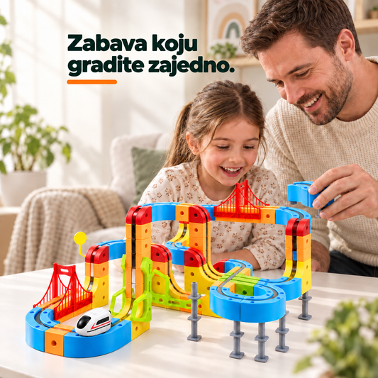 Roditelj i dete zajedno slažu magnetnu stazu sa vozićem